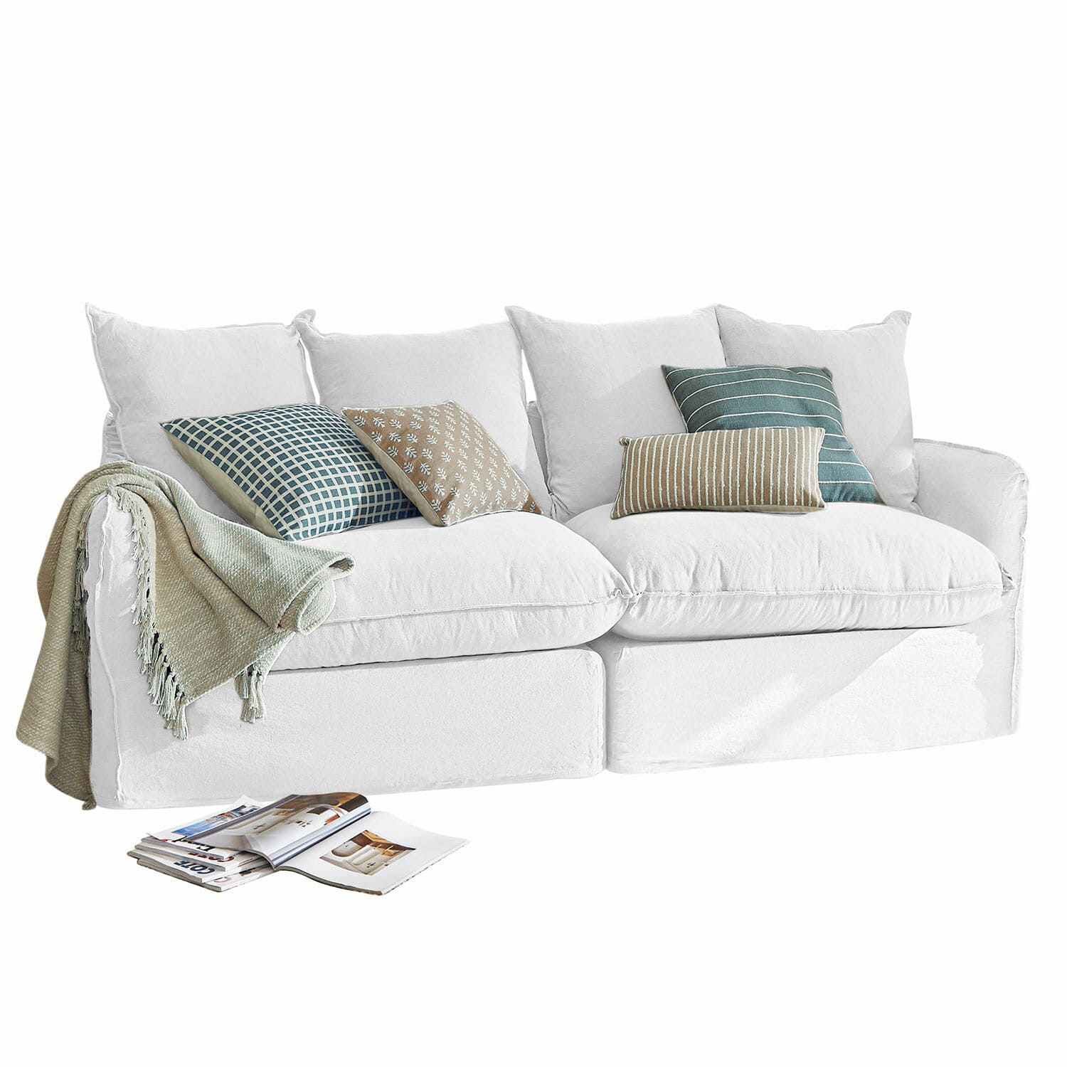 Sofa Dunswater Biała sofa z tkaniny z poduszkami w zielone i beżowe wzory oraz miękki koc, nowoczesny salon