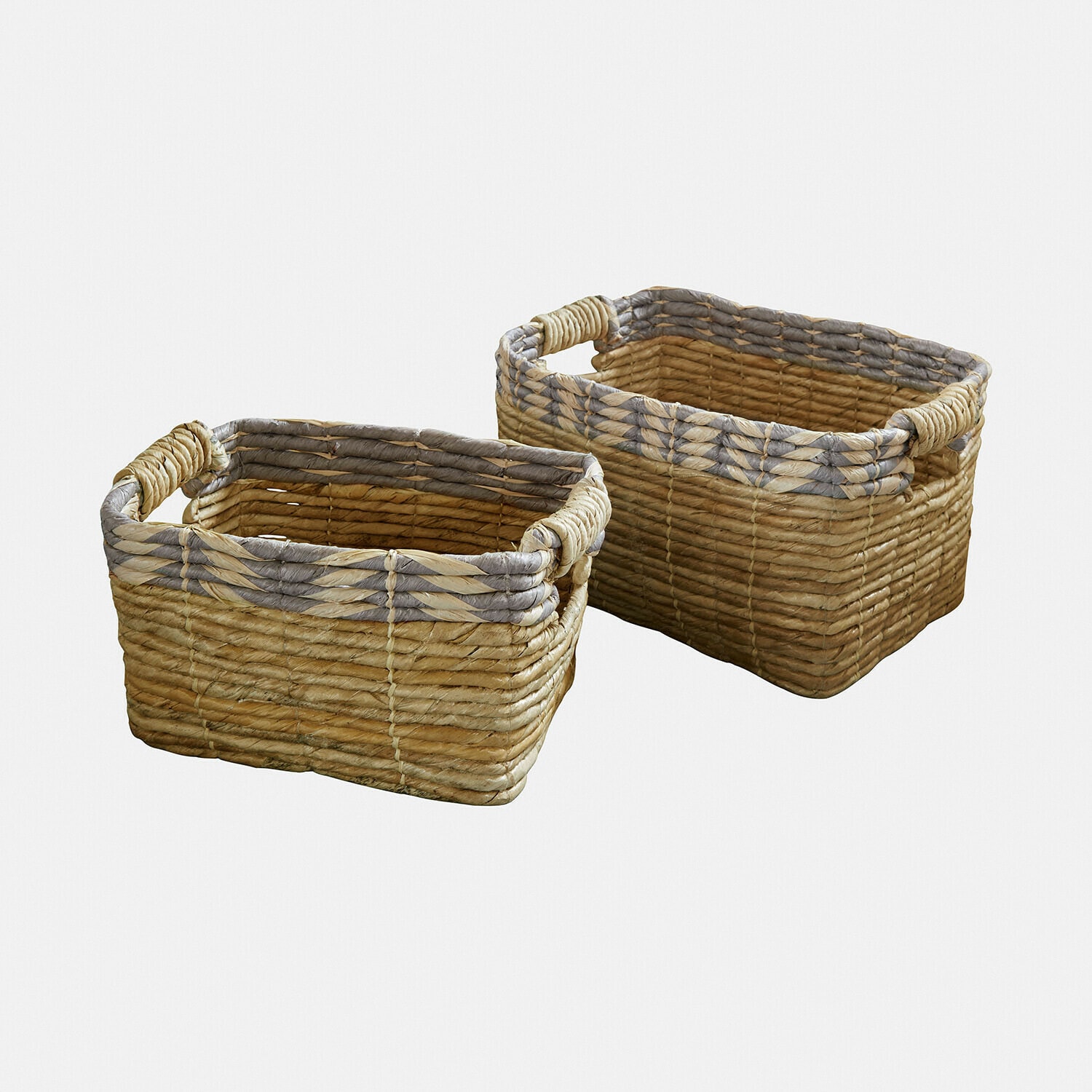 Zestaw dwóch prostokątnych koszy z plecionego trzciny w naturalnym i szarym kolorze do przechowywania