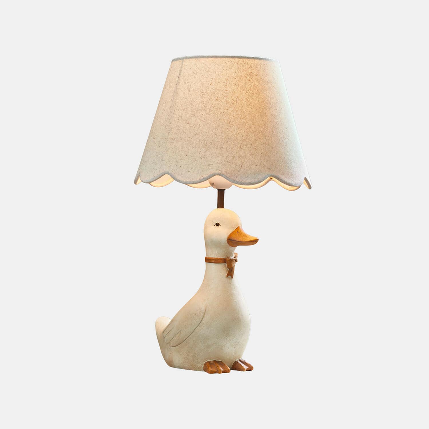 Lampa do pokoju dziecięcego Tillyboo Lampka stołowa z abażurem i podstawą w kształcie białej kaczki z pomarańczowym dziobem