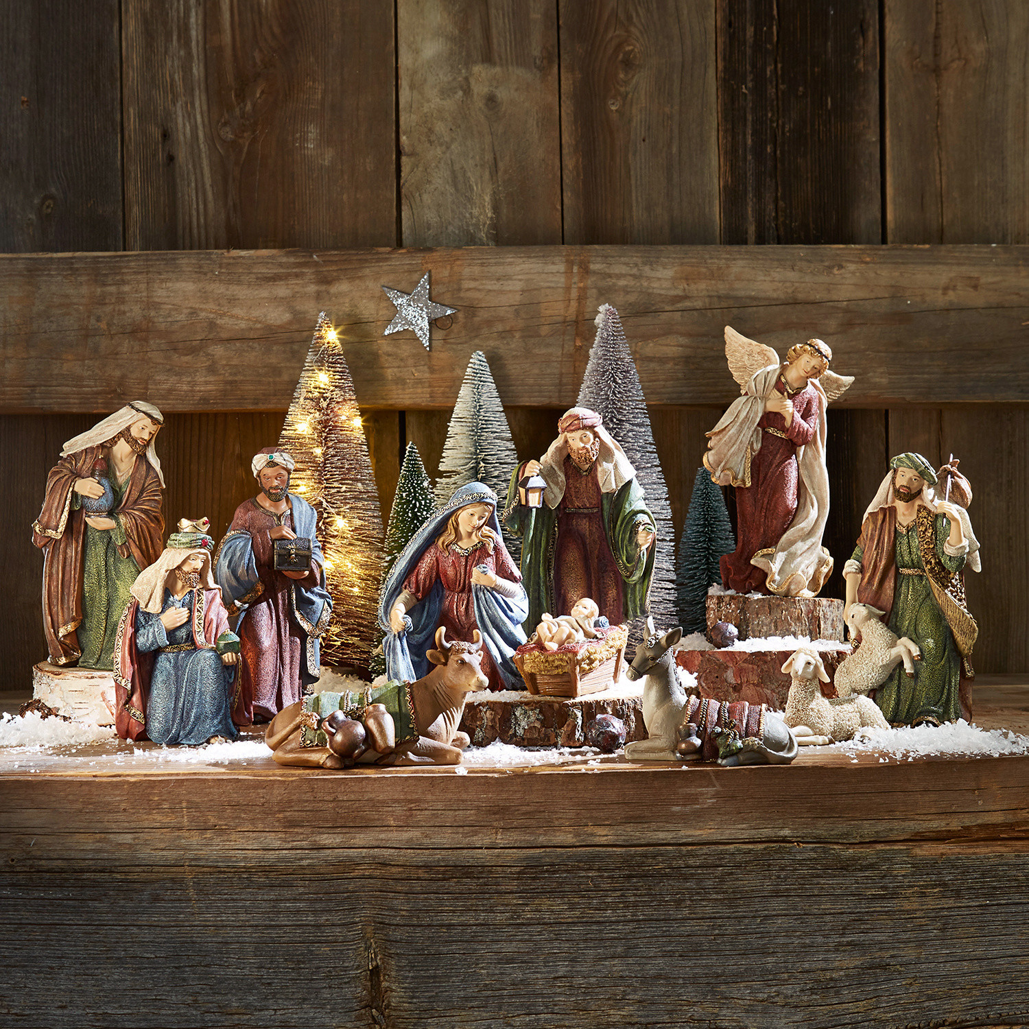 Figurka do szopki, zestaw 11 szt. Christi Zestaw figurek szopki bożonarodzeniowej z drewna i żywicy w naturalnych kolorach na drewnianym tle