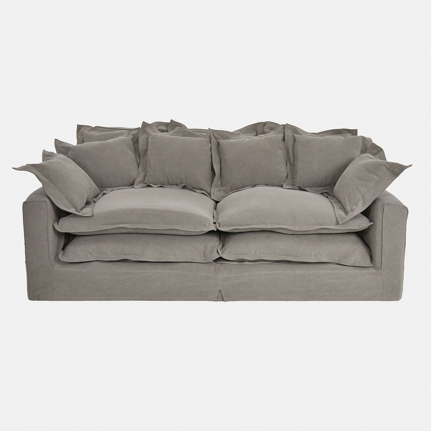 Szara sofa Terell z miękkiej tkaniny z licznymi poduszkami, wygodna do salonu