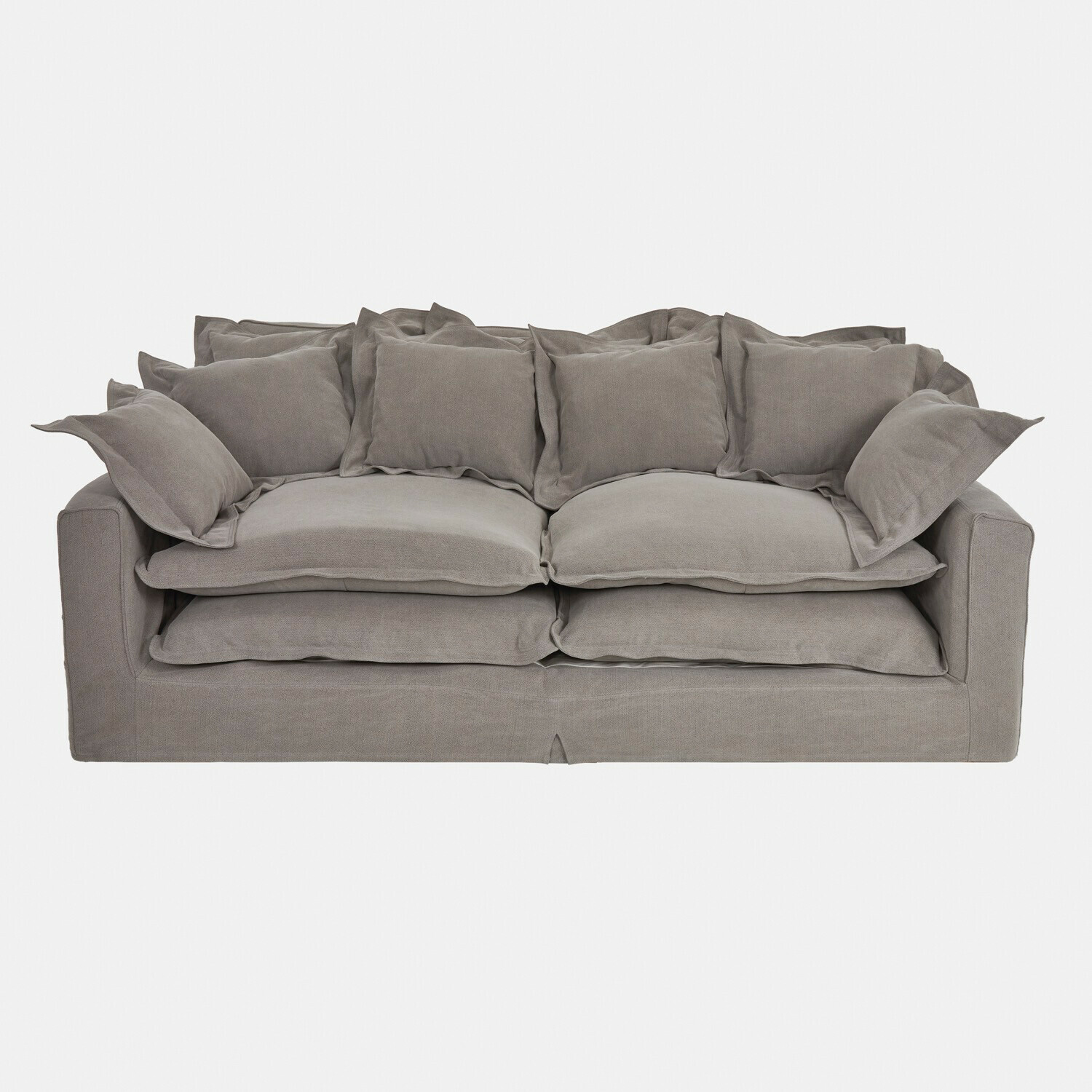 Szara sofa Terell z miękkiej tkaniny z licznymi poduszkami, wygodna do salonu